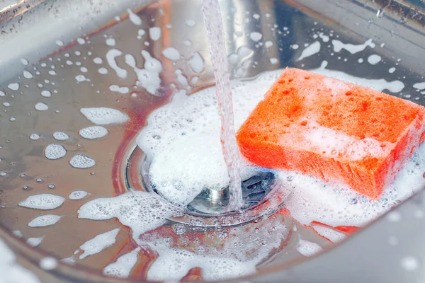 Water Running Tap Sink Orange Sponge Washing Foam Drain Strainer — Stock Photo, Image