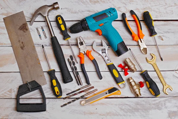 top view of set of hand tools on wooden background