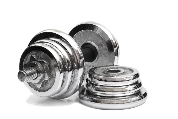 adjustment dumbbell and set of weight plates isolated on white background