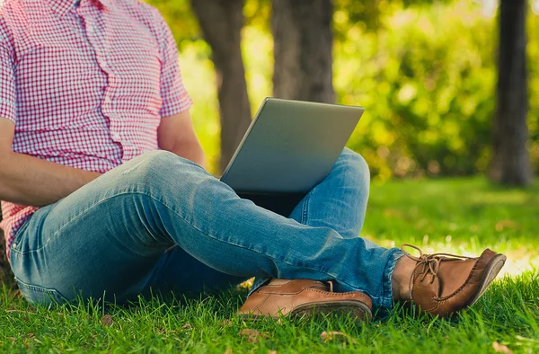 Young man Working in the Park with Laptop Computer — Stock Photo, Image