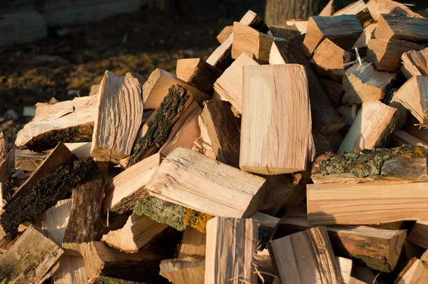 Firewood background - chopped firewood on a stack — Stock Photo, Image