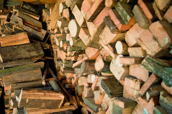 Pile of chopped wood slide firewood — Stock Photo, Image