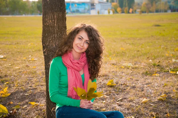 Curly young woman in autumn — Stock Photo, Image