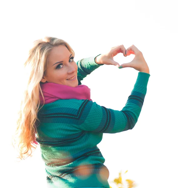 Pretty girl making hands in heart shape — Stock Photo, Image