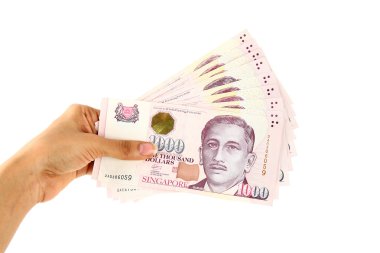 Hand holding Singapore currency clipart