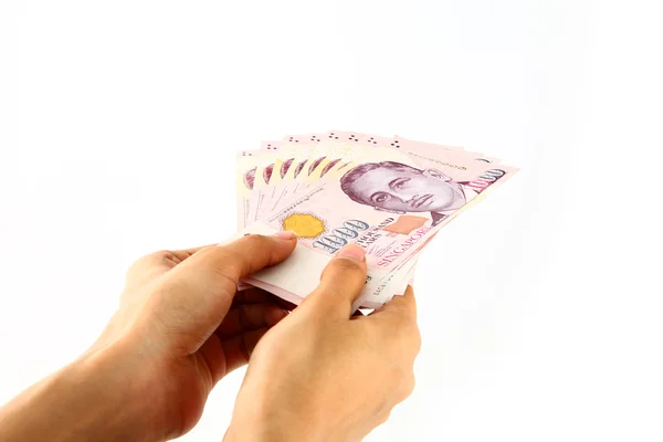 Ręce holdingsingapore walut — Zdjęcie stockowe