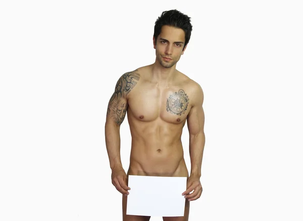 Sexy man holding a white cardboard — Stock Photo, Image