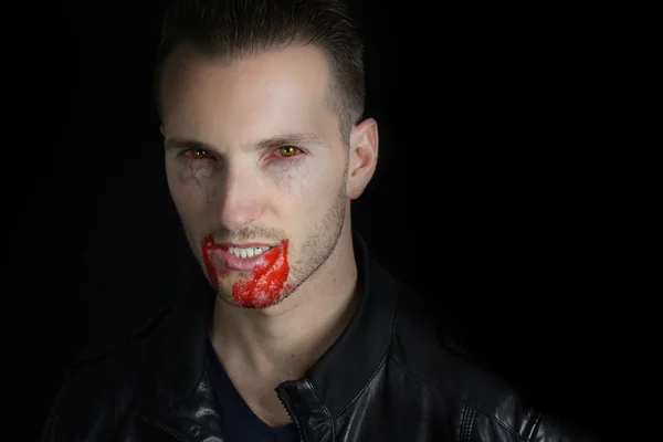 Portrait of a young vampire with blood on the lips — Stock Photo, Image