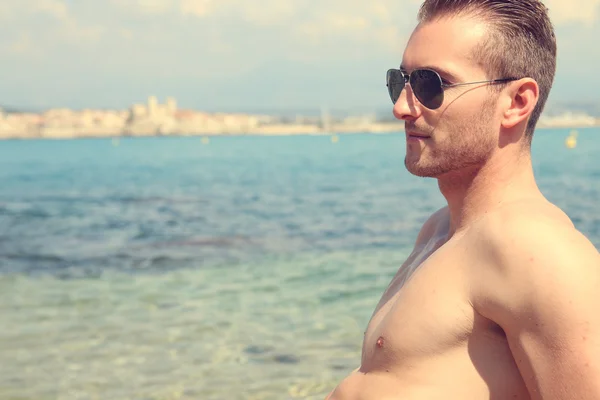 Young man at the beach — Stock Photo, Image