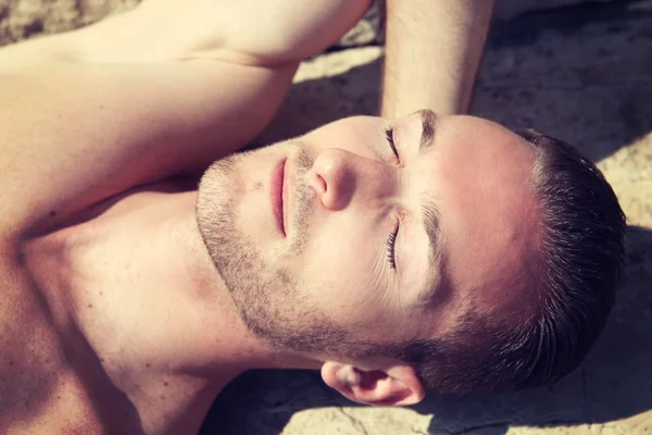 Portrait of a handsome man making a sunbath — Stock Photo, Image