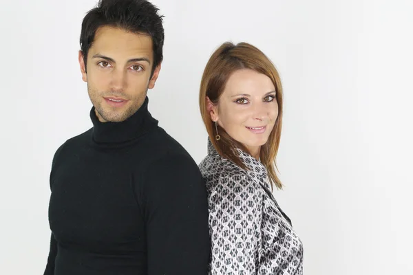 Young couple posing back to back — Stock Photo, Image