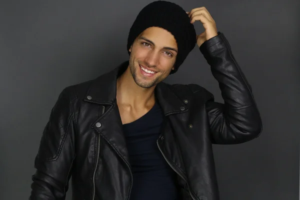 Handsome fashion man wearing a black hat — Stock Photo, Image