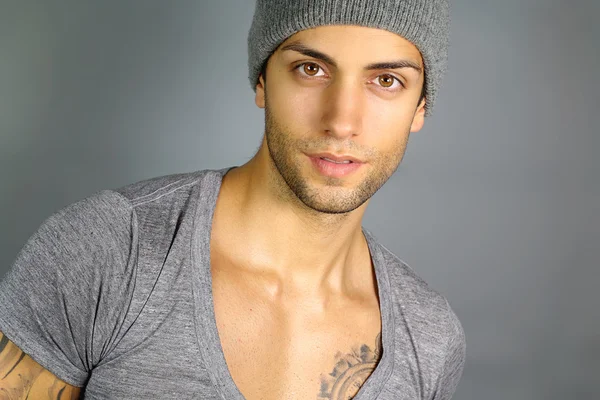 Young attractive man with a hat — Stock Photo, Image