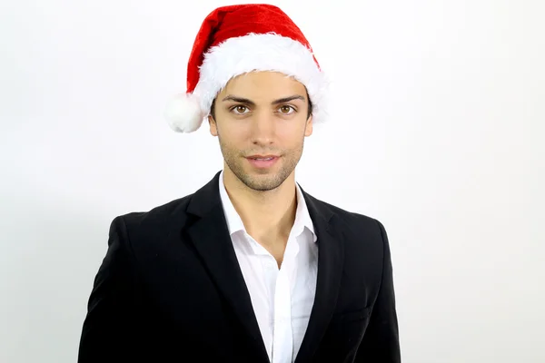 Jovem homem de negócios com um chapéu de Pai Natal — Fotografia de Stock