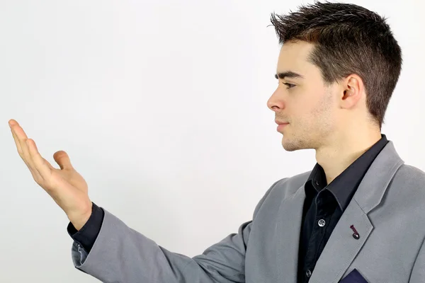 Joven hombre de negocios mirando su mano —  Fotos de Stock