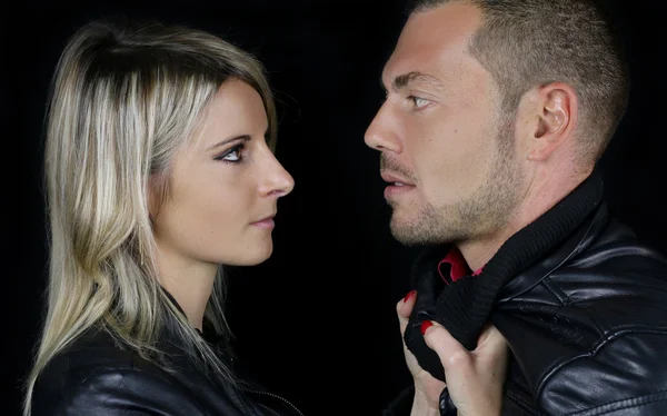 Young couple dressed in a black leather jacket — Stock Photo, Image