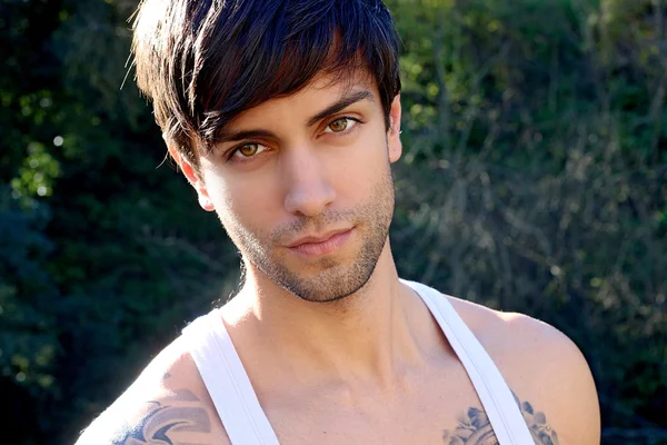 Portrait of a beautiful man with bangs — Stock Photo, Image