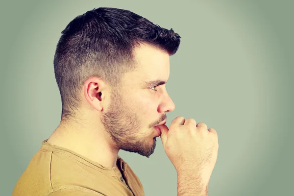 Young man who sucks his thumb — Stock Photo, Image