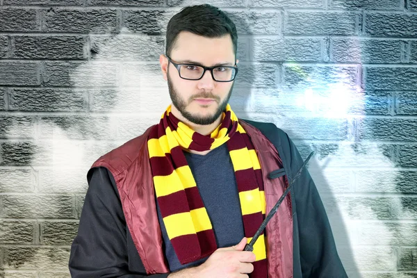 Young magician showing his magical wand — Stock Photo, Image