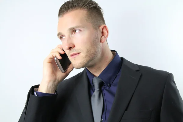 Businessman with a mobile phone Stock Picture