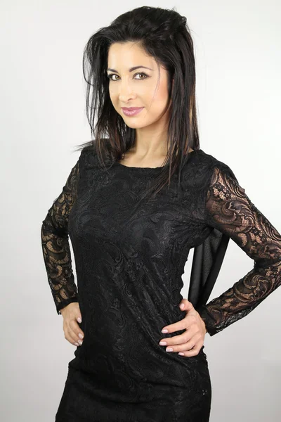 Beautiful woman with an elegant black dress — Stock Photo, Image