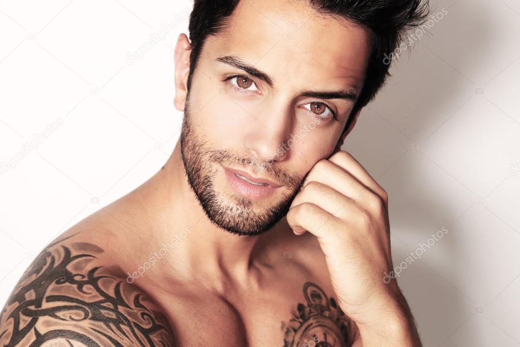 Handsome brown man smiling Stock Photo by ©rdrgraphe 73389929