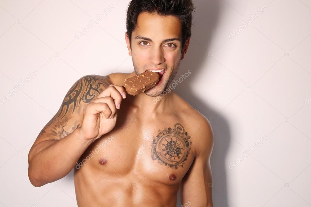 sexy male eating ice cream