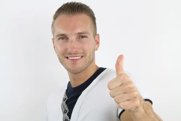 Handsome blond hair man holds his thumbs up — Stock Photo, Image