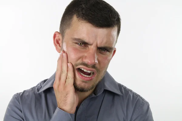 Человек с зубной болью — стоковое фото