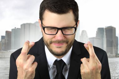 young businessman praying clipart