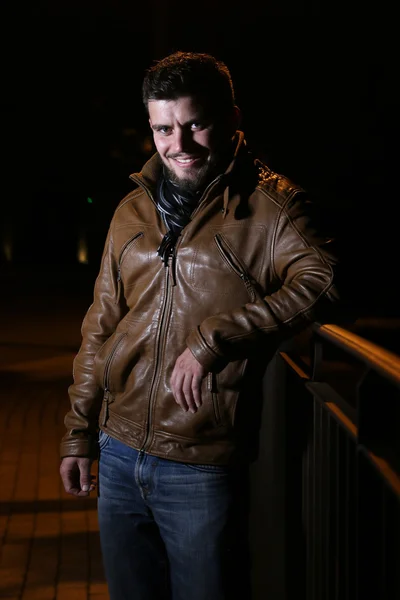 Young man smiling during a night — Stock Photo, Image