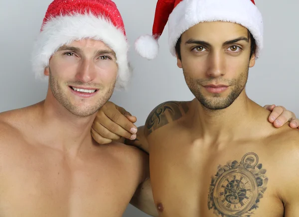 Christmas time - two sexy sexy santa claus — Stock Photo, Image