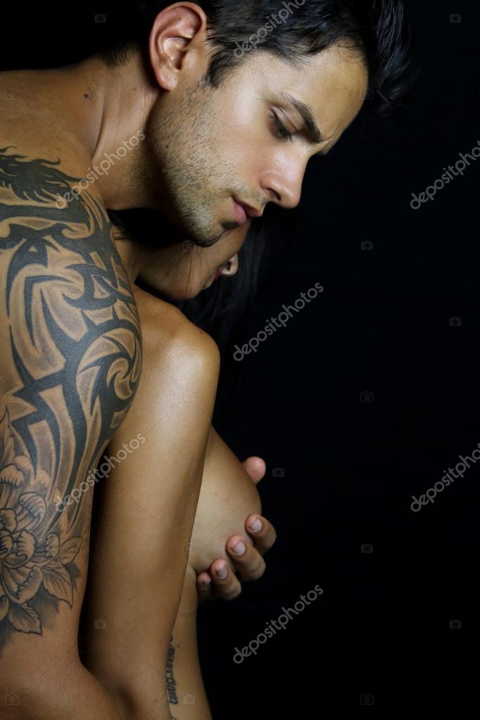 Sex relationship - man touching breast Stock Photo by ©rdrgraphe