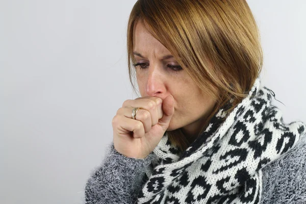 Blonde woman coughing — Stock Photo, Image