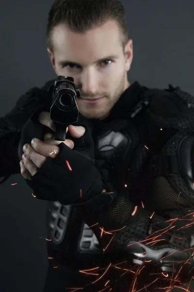 Super cops - blond man posing with a gun — Stock Photo, Image