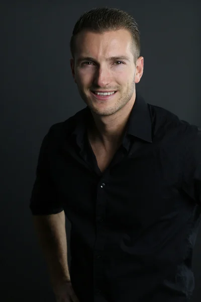 Handsome guy wearing a black shirt — Stock Photo, Image