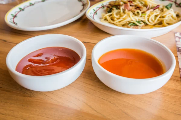 Tomato sauce and hot chili sauce. — Stock Photo, Image