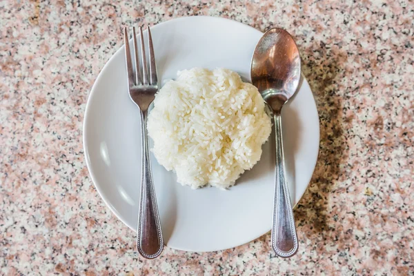 Rice in white dish with silverwar — Stock Photo, Image