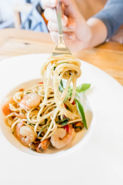 Spicy spaghetti seafood in white dish — Stock Photo, Image