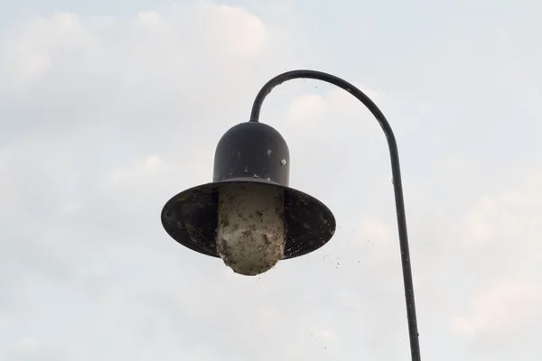 Old dirty glowing lamp — Stock Photo, Image