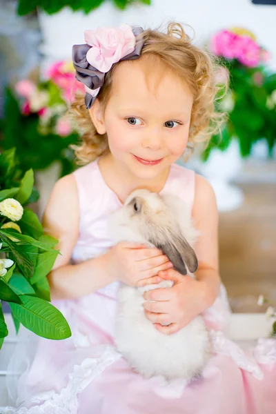 Little girl with a rabbit — Stock Photo, Image