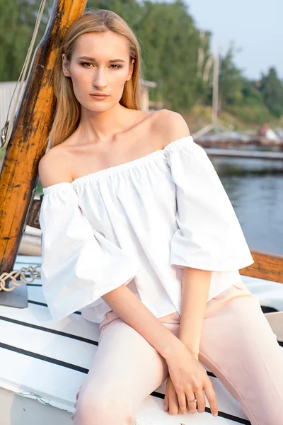 girl posing in the boat