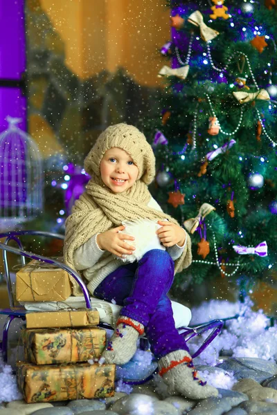 The girl near a Christmas fir-tree 2 Stock Picture