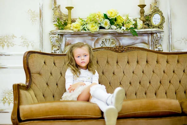The little girl on a sofa — Stock Photo, Image
