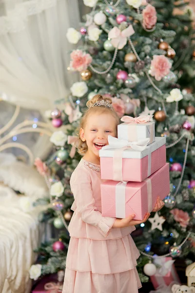 The little girl near a Christmas fir-tree Stock Picture