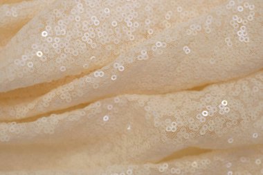 Parlak pullu hafif kumaş.