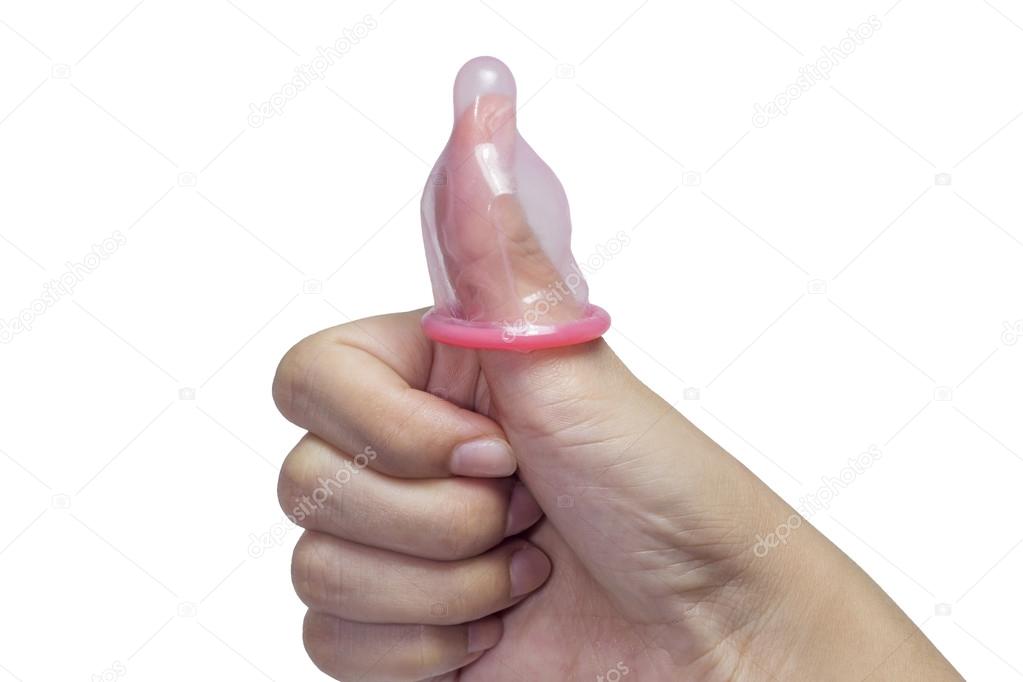Thumb and condom over a white background