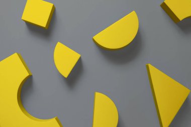 Sarı geometrik şekillerin düz bileşimi gri arkaplanda yatıyordu. Yılın Renkleri 2021 Pantone Aydınlatıcı ve Nihai Gri. Minimalizm kavramı.