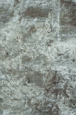Arkaplan dokusu. Beyaz boya kalıntılarıyla yaşlanmış beton yüzey. Üst görünüm, boşluğu kopyala. Dikey