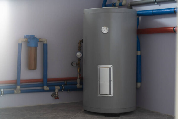 Tank for indirect heating of boiler, flow filter for fine cleaning, boiler piping and meters in boiler room of private house